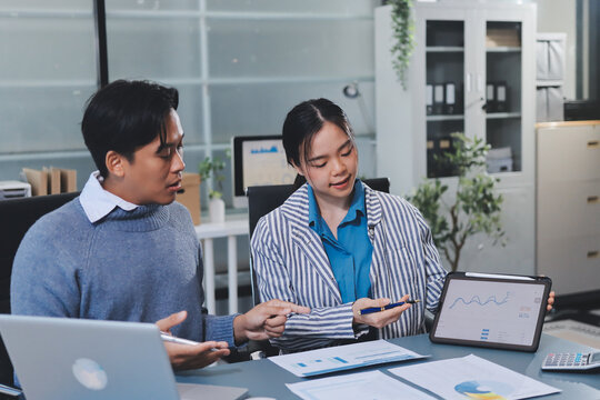 Business professional analyzing financial data on digital tablet dashboard with calculator and laptop, representing accounting software, ERP system integration, performance monitoring.