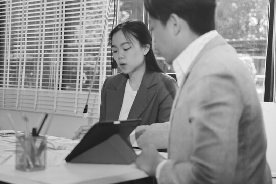 Business professional analyzing financial data on digital tablet dashboard with calculator and laptop, representing accounting software, ERP system integration, performance monitoring.