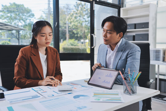 Business professional analyzing financial data on digital tablet dashboard with calculator and laptop, representing accounting software, ERP system integration, performance monitoring.
