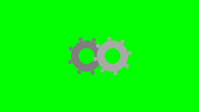 Two interlocking gears rotating on a green screen background.