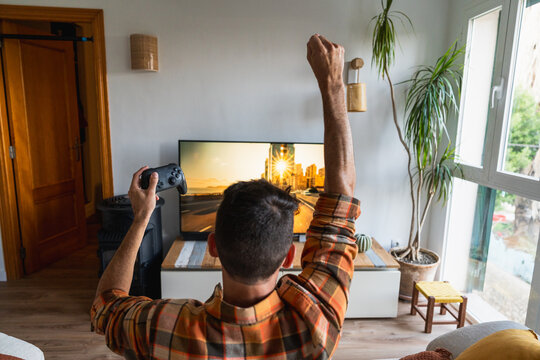 Person enjoying playing video game on sick day