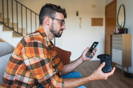Man choosing gaming over answering a boss call