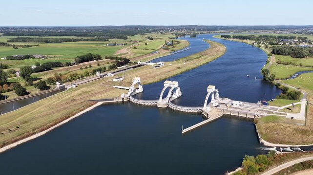 Aerial drone view of the Amerongen weir and navigation lock on the Lower Rhine, featuring hydraulic engineering, hydropower, water management and inland shipping infrastructure.