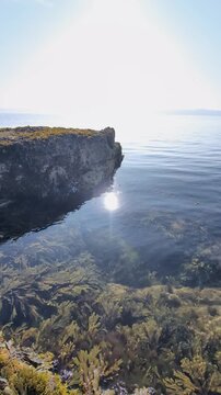 sun gleaming on the forth of clyde on the west coast of Arran, Scotland