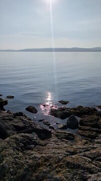 sun gleaming on the forth of clyde on the west coast of Arran, Scotland