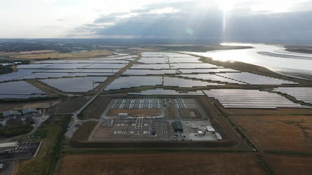 Aerial drone view of Cleve Hill Solar Park near Faversham, Kent, showing large-scale renewable electricity generation, battery storage and modern solar infrastructure.