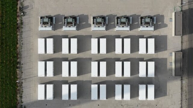 Aerial drone view of Cleve Hill Solar Park near Faversham, Kent, showing large-scale renewable electricity generation, battery storage and modern solar infrastructure.