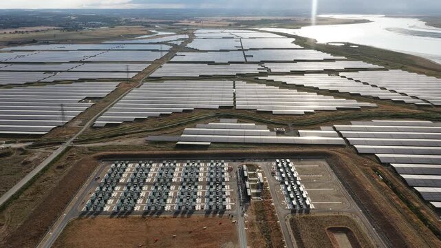 Aerial drone view of Cleve Hill Solar Park near Faversham, Kent, showing large-scale renewable electricity generation, battery storage and modern solar infrastructure.