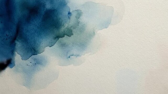 Dark blue watercolor bleed expanding slowly on textured white paper