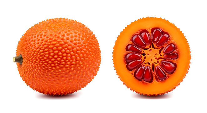 Whole and halved gac fruit isolated on a white background for healthy food and nutrition concepts
