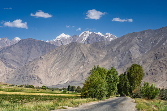 Scenic summer landscape view on snowcapped Hindu Kush mountain range in Afghanistan, Ishkashim, Gorno-Badakhshan, Tajikistan Pamir