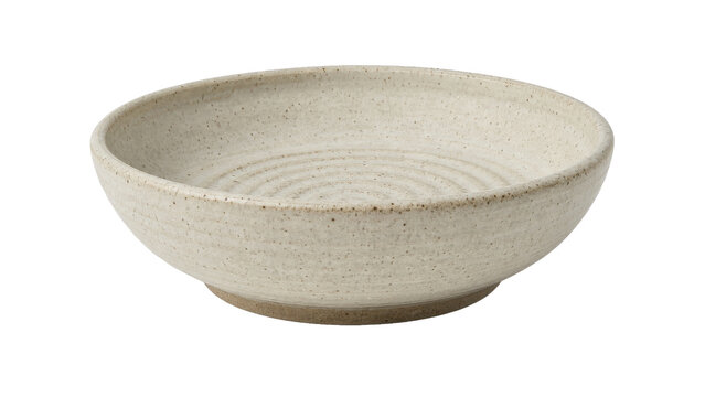 Empty beige ceramic bowl with a textured surface and subtle brown speckles, featuring concentric rings inside, isolated on a white background