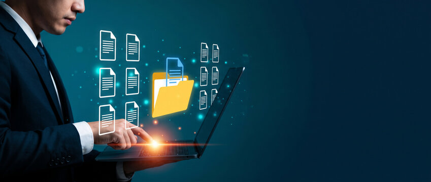 Business professional using a laptop with virtual document and folder icons floating above the keyboard, organizing digital files in an electronic document management system, document management, digi