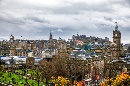 Edinburgh, Scotland - April 9, 2024: View across Edinburgh city centre from Calton Hill featuring Edinburgh Castle, Balmoral Hotel and historic architecture, Scotland.