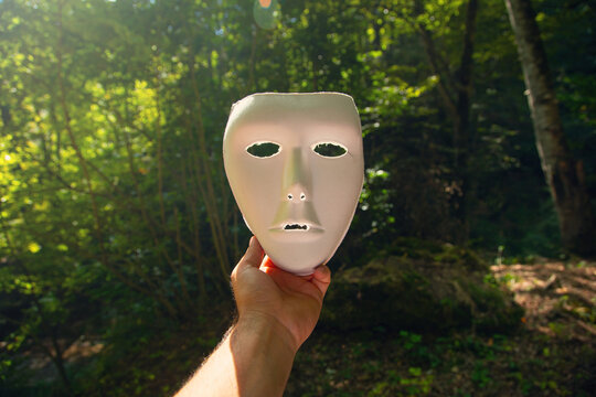 White mask in the forest.