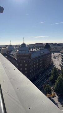 Vertical Helsinki, Hakaniemi Rooftop Pan Over a Nordic City Street and Bay