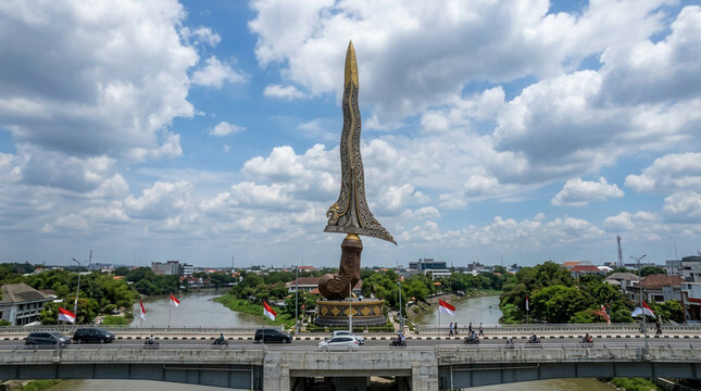 Iconic Kris Statue Dominates Cityscape With Dramatic Sky