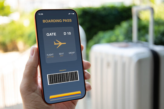 Man hand holding phone with digital boarding pass airport luggage