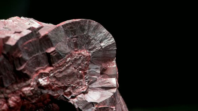 Hematite or Haematite (principal ore of iron) 'kidney ore' - sample against a black background.