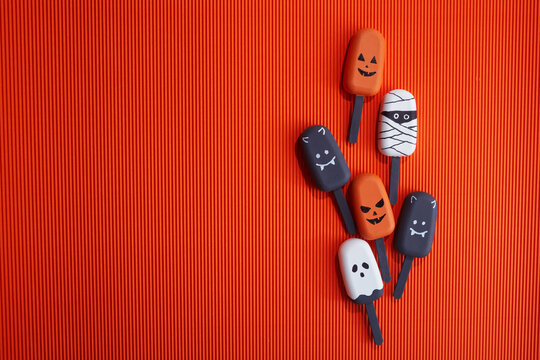 Halloween treats including pumpkin, mummy, ghost, and bat popsicles