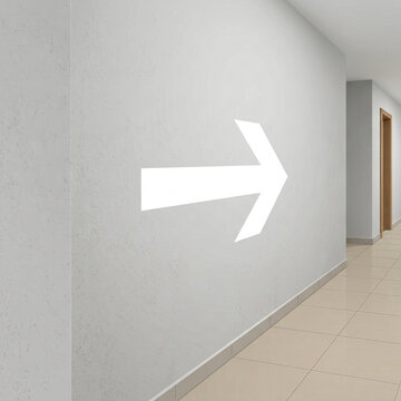 Clear Directional Arrow Symbol on a Modern Hallway Wall