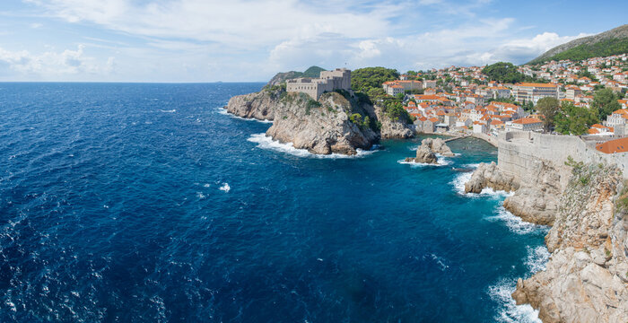 Panoramic view of the historic Fort Lovrijenac on a rocky cliff and the blue Adriatic Sea in Dubrovnik, Croatia, on a sunny day