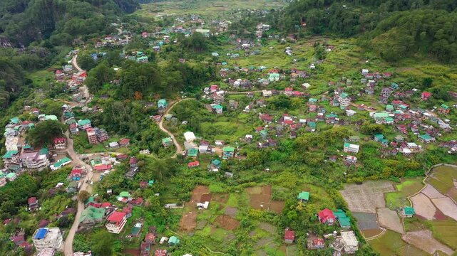 Aerial view town of Sagada, located in the mountainous province of Philippines. City in the valley among the mountains covered with forest. Sagada-Cordillera region-Luzon island.