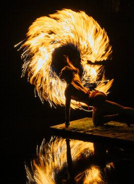 Fire African American dancer spinning flames creating dynamic