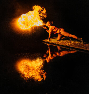 Female fire breather performing