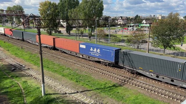 Cargo Containers Transportation On Freight Train By Railway. Shipping containers. Rail Freight Shipping Logistics. Maritime containers shipping from Сhina. Minsk, Belarus, September 10. 2026