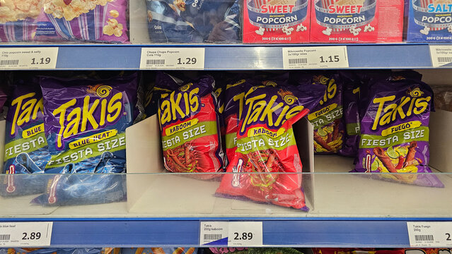Takis chips on supermarket shelf offering different spicy flavors