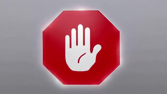 Glowing Red Stop Sign with Raised Hand Symbol Rotating