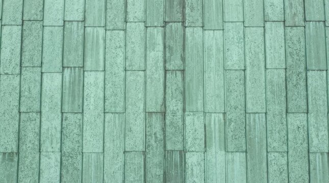 Green copper patina texture with weathered streaks