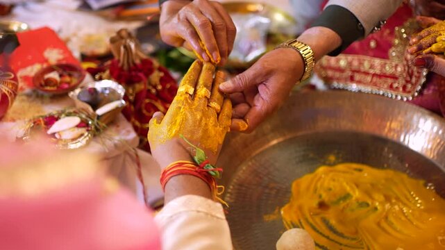Indian bride receiving turmeric paste during haldi ceremony in Ghaziabad