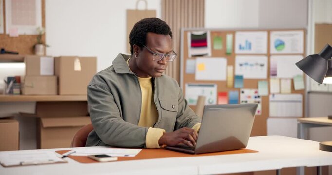 Ecommerce, man and typing in office with laptop, check paperwork or data collection for online order. Black person, reading and stats analysis in small business with computer, document or sales info.
