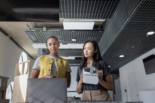 Two Women Collaborating with virtual reality Technology Tools