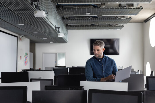 Contemplative Man in Modern Office Setting