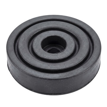 Round black rubber mounting pad featuring concentric rings designed for vibration dampening in heavy industrial machinery isolated on white background