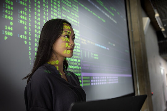 Confident woman explaining future technology in a meeting