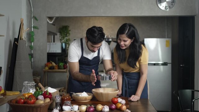 Man and Woman Prepare Ingredients at Kitchen Table