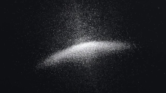 Forming cloud of white specks on dark backdrop, vertical stream initiating and feeding bright band