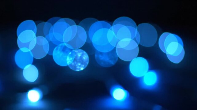 Closeup of Blue LED Lights Creating Bokeh Effect in Dark Environment