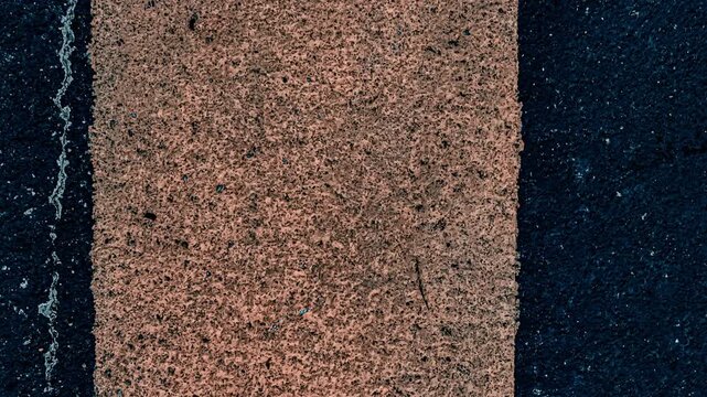 Close-up texture of asphalt with painted lines