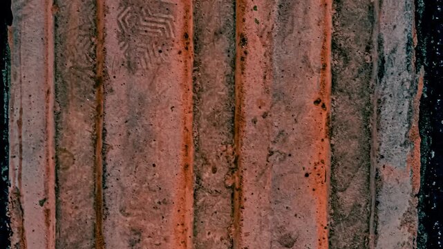 Textured ground surface with raised pattern