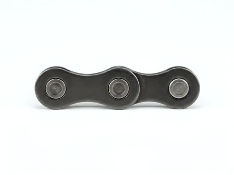 Bicycle chain link segment with three roller bearings on white background
