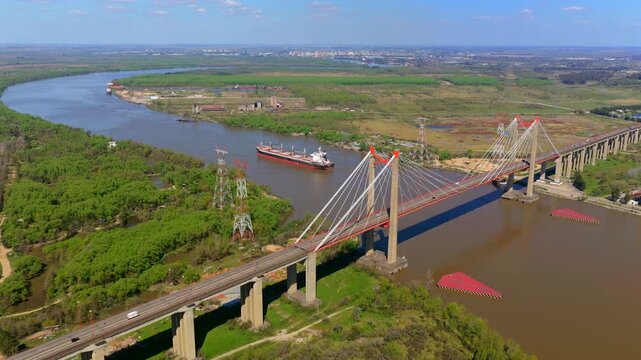 Cargo Ship Passing Under Z&aacute;rate&ndash;Brazo Largo Bridge on the Paran&aacute; River, Buenos Aires Province, Argentina.