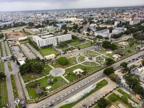 Aerial view of Johnson Jakande Tinubu Park with its circular walkways, green lawns, and surrounding urban infrastructure in Ikeja, Lagos, Nigeria.