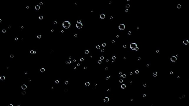 soap water bubbles background, Water bubbles rising up and exploding. Water Bubbles filled carbon dioxide and float upwards. Colorful soap bubbles fly across black background.