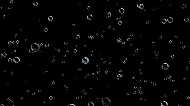 soap water bubbles background, Water bubbles rising up and exploding. Water Bubbles filled carbon dioxide and float upwards. Colorful soap bubbles fly across black background.