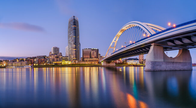 Modern urban district and Danube bridge at blue hour Bratislava
